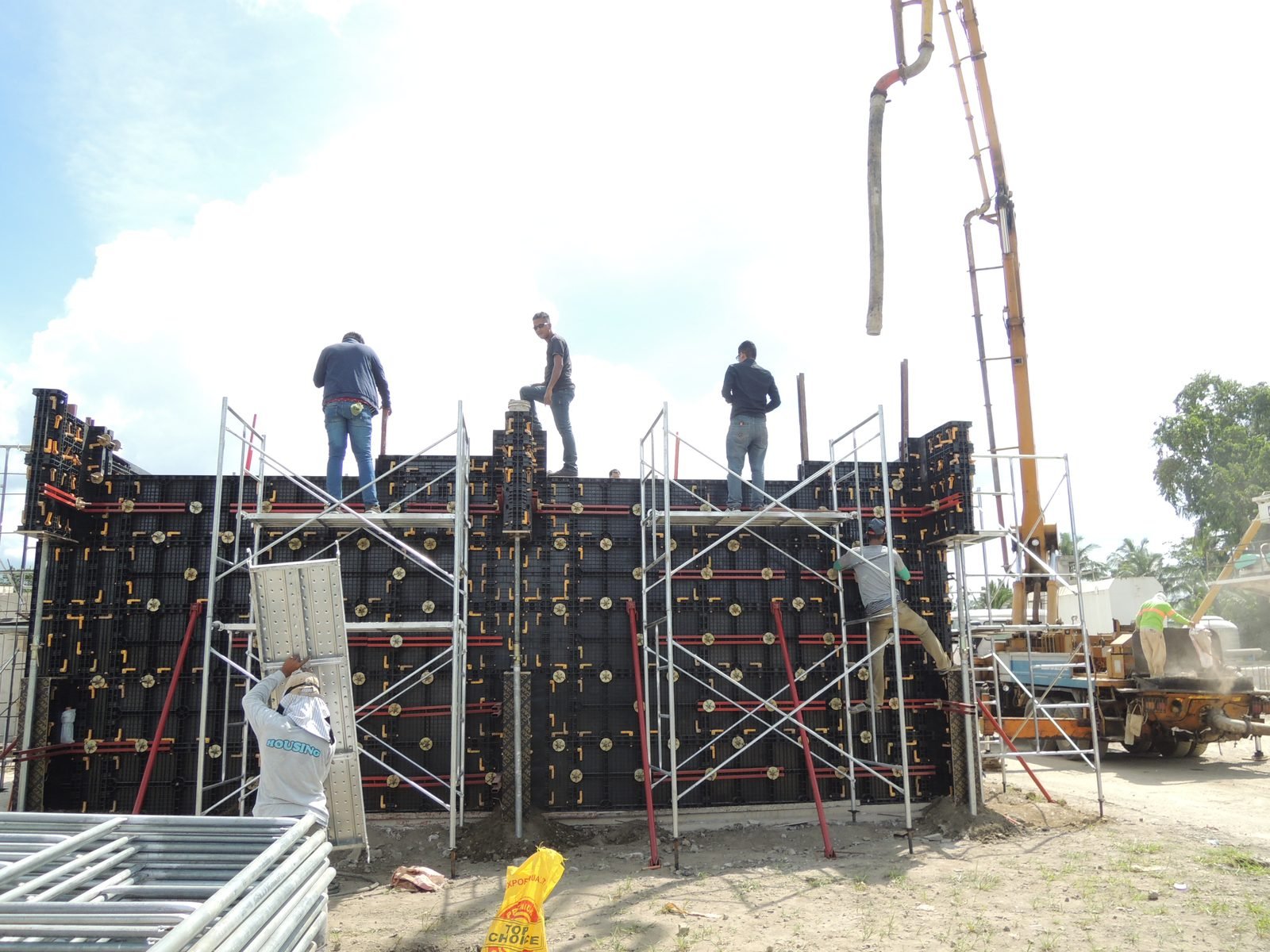 WINLONG concrete pouring into plastic formwork with workers